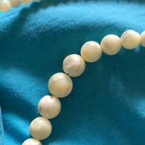 Shell necklace with graduated beads.